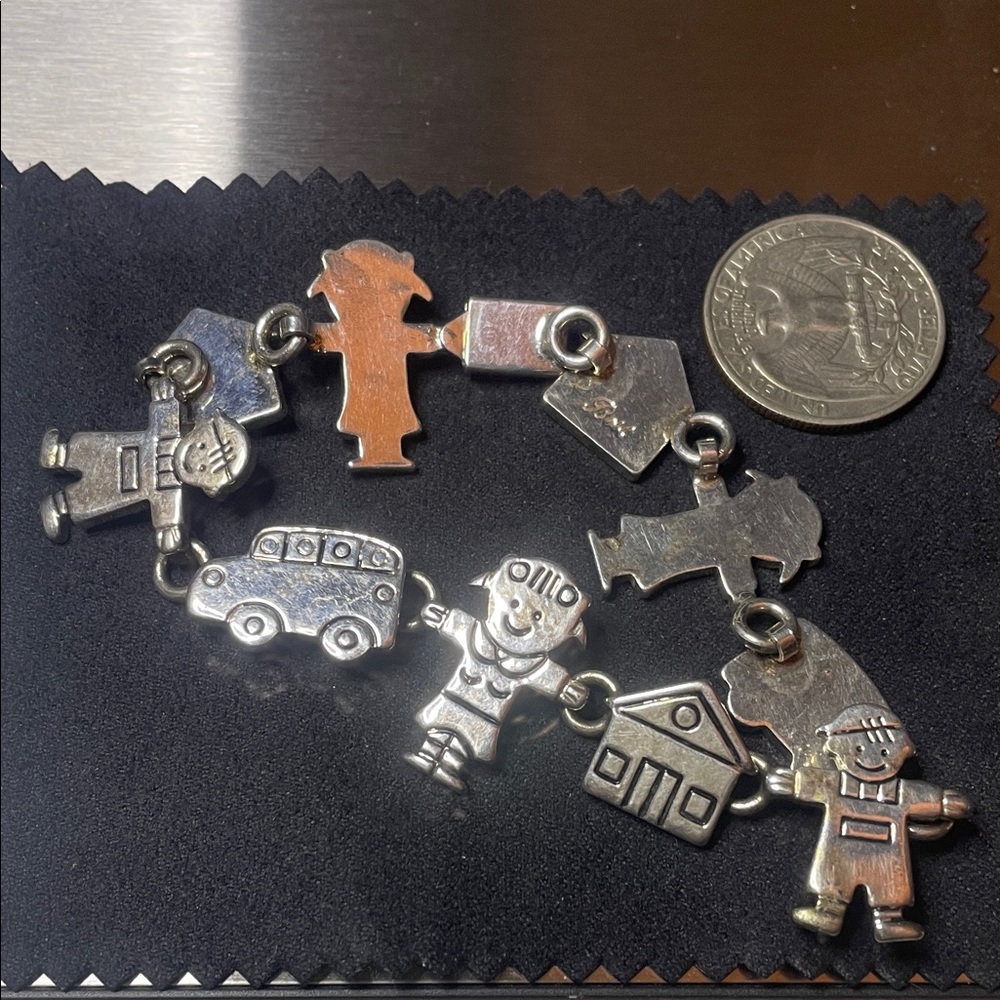 Silver Charm Bracelet with Figures marked Bolt